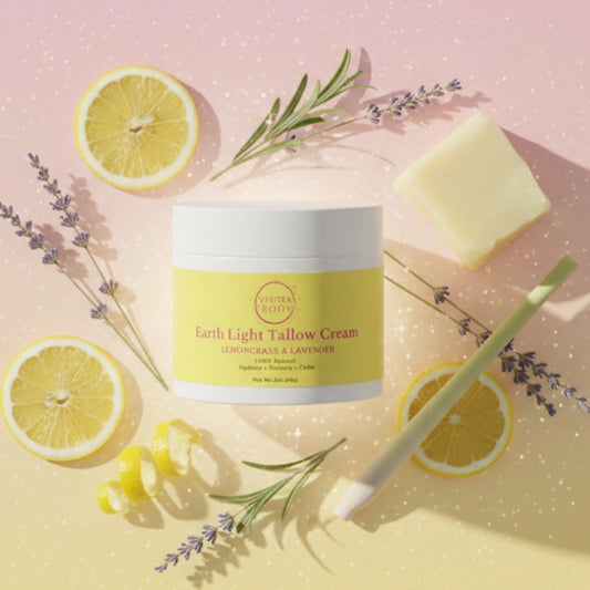 Earth Light Tallow Cream jar surrounded by lemongrass, lavender, and natural tallow ingredients, highlighting its clean, nutrient‑rich skincare formula.