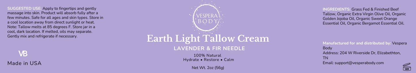 Close‑up of the Earth Light Tallow Cream Lavender & Fir Needle label with sharp, readable details under cool evening light and a subtle celestial indigo backdrop.