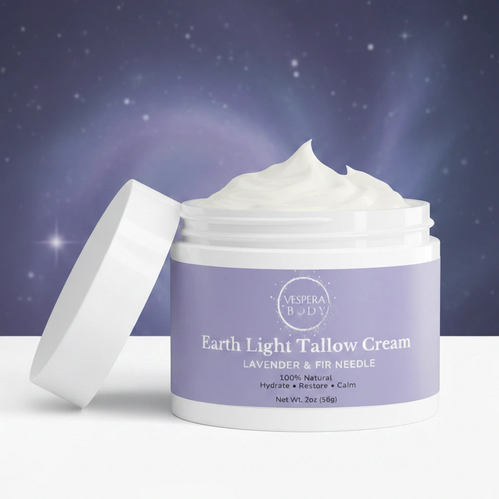 Open jar of Earth Light Tallow Cream Lavender & Fir Needle showing its soft whipped tallow texture under cool evening light with subtle celestial reflections.