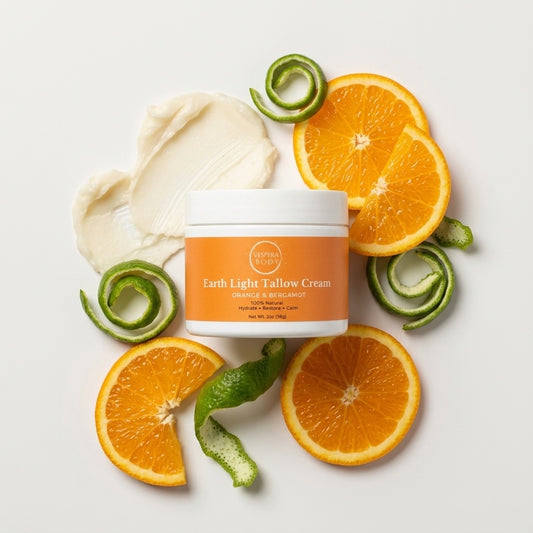Earth Light Tallow Cream Orange & Bergamot variant in a clean flat lay with visual representations of tallow, emphasizing its natural ingredients.