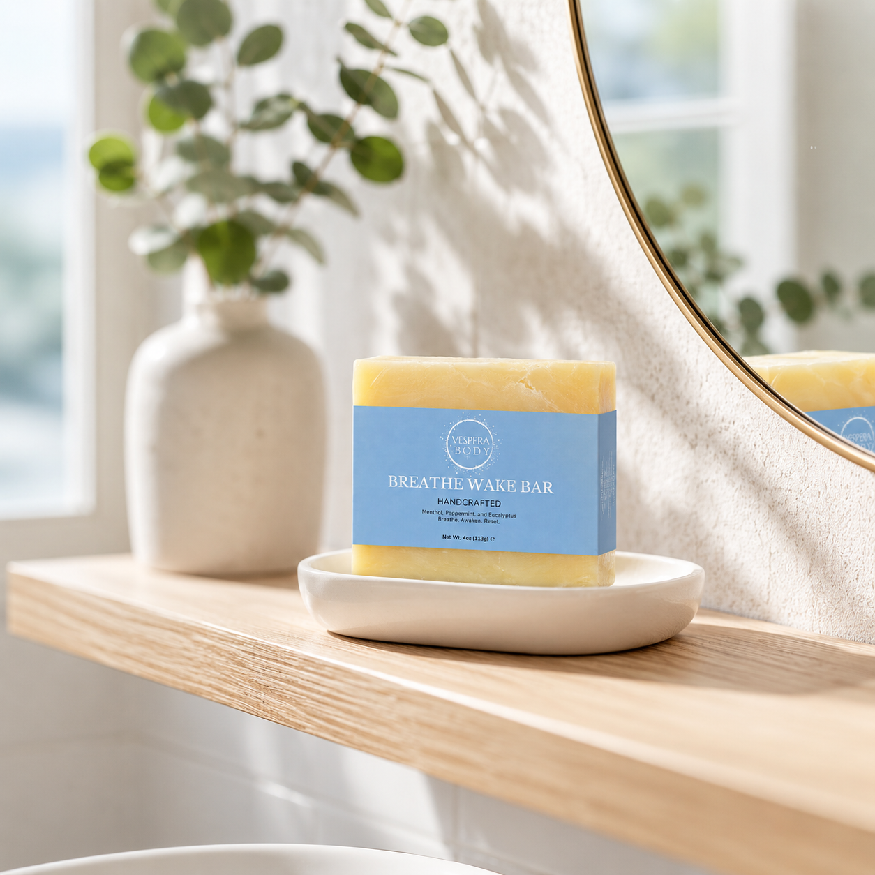 Vespera Body Breath Wake moisturizing soap bar on a modern minimalist bathroom shower shelf.